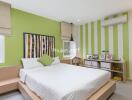 Modern bedroom with green accent walls and minimalist furniture