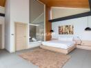 Modern bedroom with platform bed, artwork, and large glass window