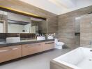 Modern bathroom with bathtub and dual sinks