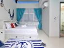 Modern bedroom with en-suite bathroom featuring nautical decor, bright curtains, and air conditioning.