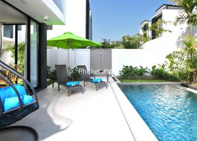 Modern outdoor area with swimming pool and seating