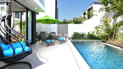 Modern outdoor area with swimming pool and seating