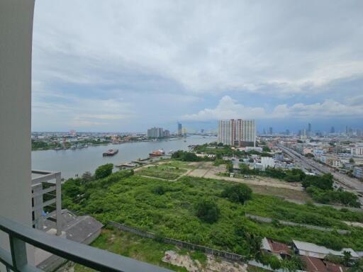 View of cityscape and river from a balcony