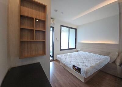 Modern bedroom with a double bed and built-in shelving