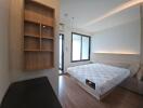 Modern bedroom with a double bed and built-in shelving