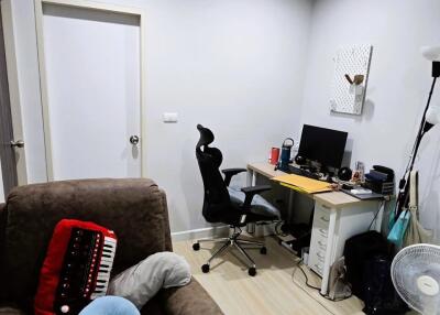 Bedroom with workspace and comfortable chair