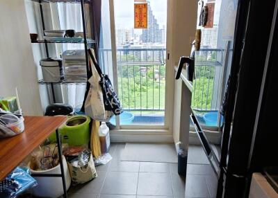 Narrow kitchen with balcony view