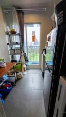 Narrow kitchen with balcony view