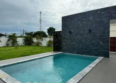 Outdoor swimming pool with surrounding patio