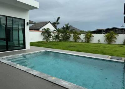 Outdoor area with swimming pool and garden