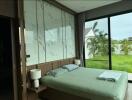 Bedroom with large glass doors