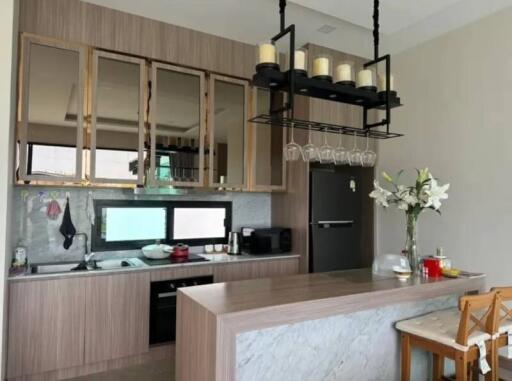 Modern kitchen with an island and decorative lighting