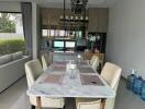 Modern dining area with marble table and stylish beige chairs