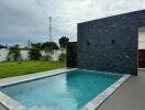 outdoor swimming pool with water feature