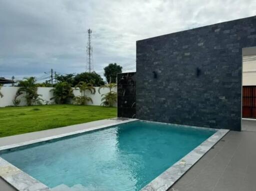 outdoor swimming pool with water feature