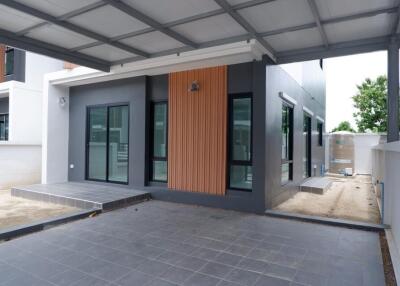 Modern single-story home exterior with covered carport