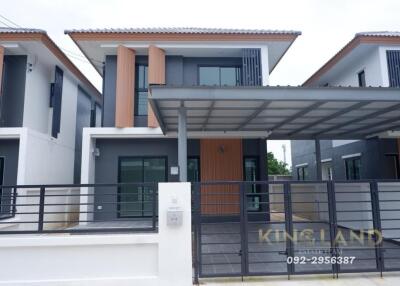 Modern two-story house with carport