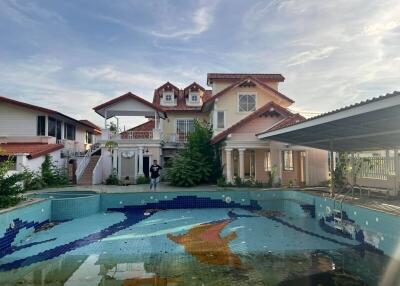 Exterior view of a house with a swimming pool