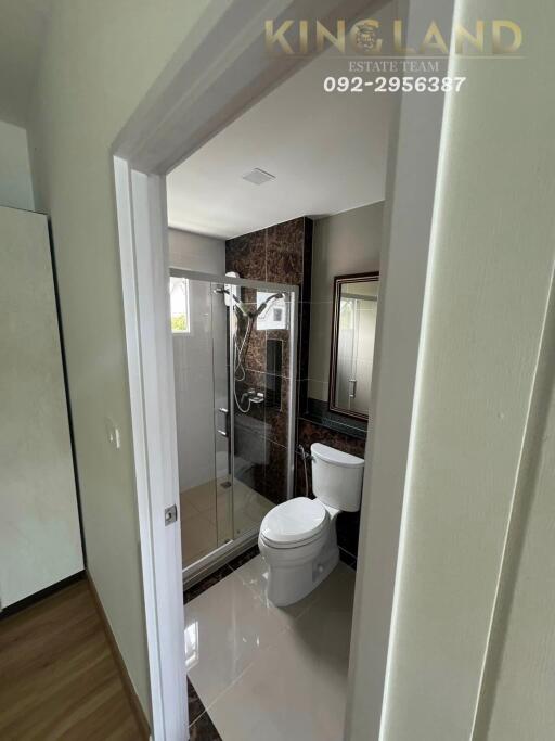 Modern bathroom with glass-enclosed shower