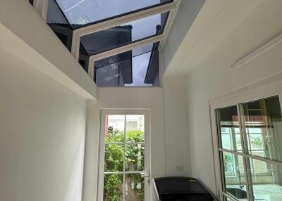 Utility room with washing machine and glass ceiling