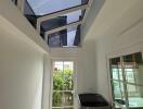 Utility room with washing machine and glass ceiling