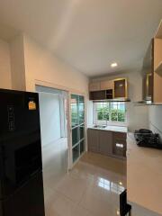 Modern kitchen with appliances and large window