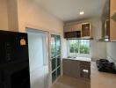 Modern kitchen with appliances and large window