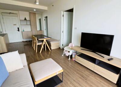 Modern living room with TV and dining area