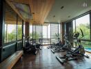 Spacious fitness center with modern exercise equipment and large windows