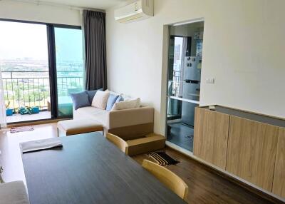 Modern living room with dining area and large windows