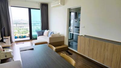 Modern living room with dining area and large windows