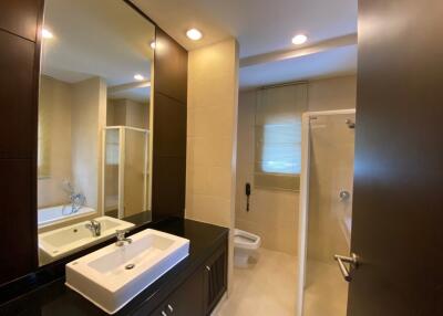 Modern bathroom with large mirror and shower