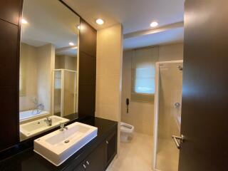 Modern bathroom with large mirror and shower