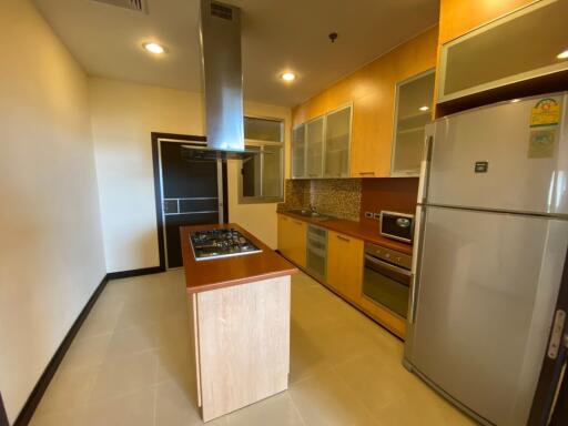 Modern kitchen with island and stainless steel appliances