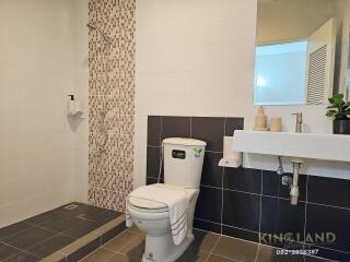 Modern bathroom with shower and toilet