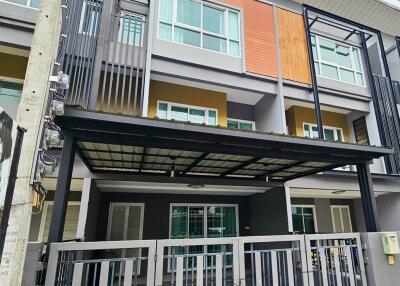 Three-story townhouse with modern facade