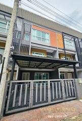 Three-story townhouse with modern facade