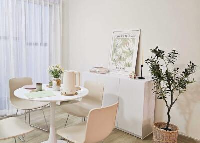 Cozy dining area with round table and four chairs