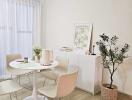 Cozy dining area with round table and four chairs