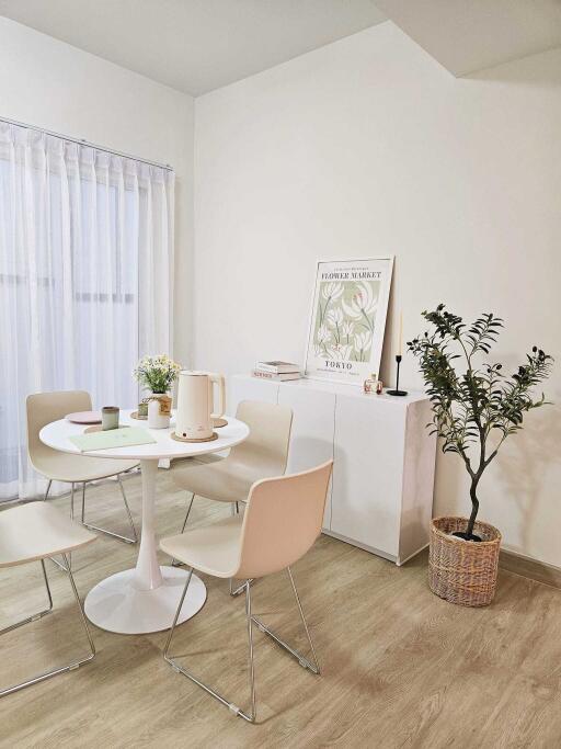 Cozy dining area with round table and four chairs