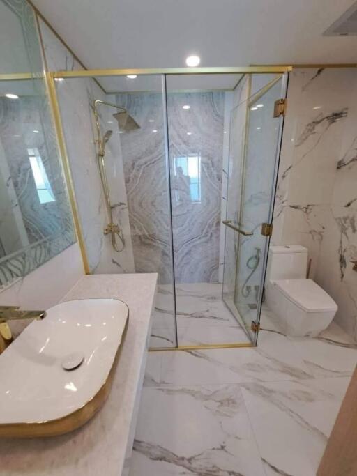 Modern bathroom with glass shower and marble design