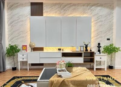 Elegant living room with modern white cabinetry and decorative elements