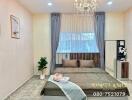 Well-furnished bedroom with a large bed, chandelier, and modern decor