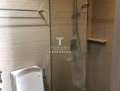 Modern bathroom with glass shower enclosure and toilet