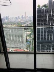 City skyline view from balcony with glass railing