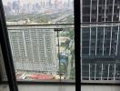 City skyline view from balcony with glass railing