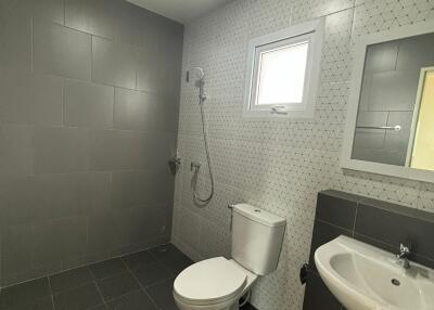 Modern bathroom with gray tiles and sanitary fixtures