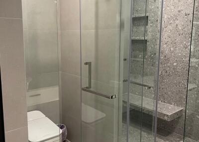 Modern bathroom with glass shower and toilet