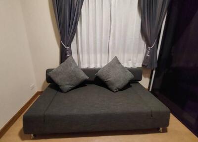 Sofa with pillows and curtain