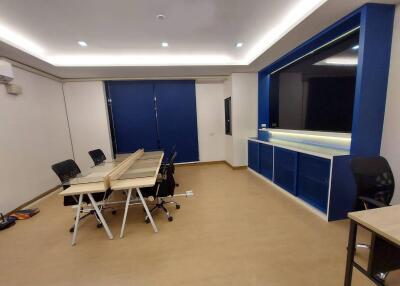 Modern office space with workstations and storage units